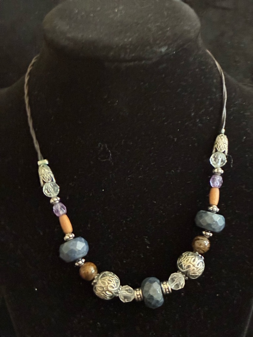 Lia Sophia EUC Necklace Blue
Sodalite Stone Wood Bead
Leather Cord Silver Tone - Picture 9 of 12
